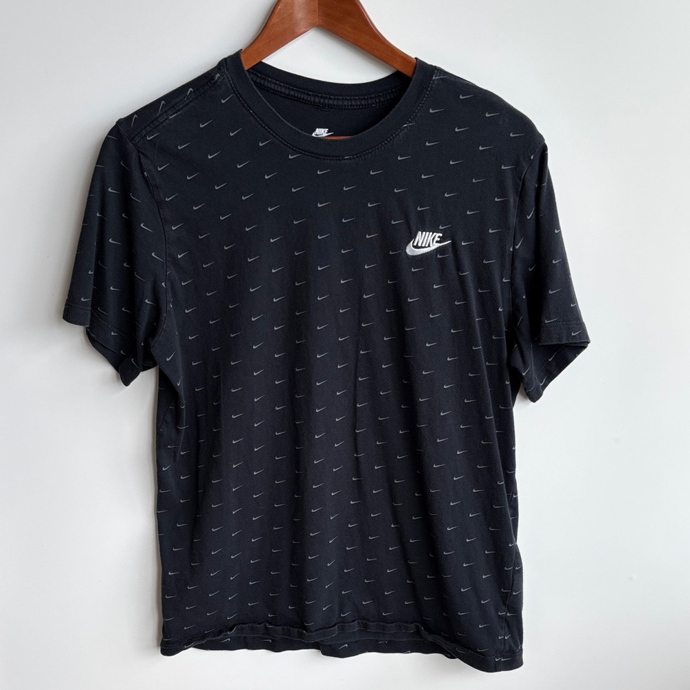 Nike Men's Black Tee with Swoosh Pattern